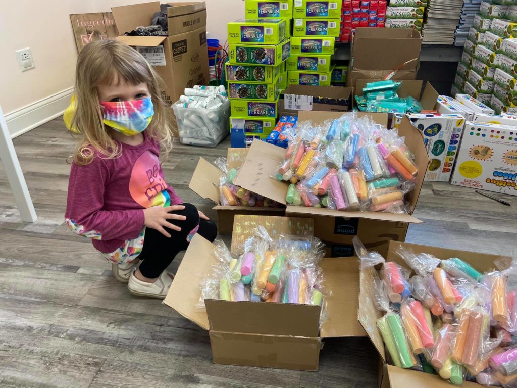 ppp loan recipient's daughter helps pack easter baskets for community